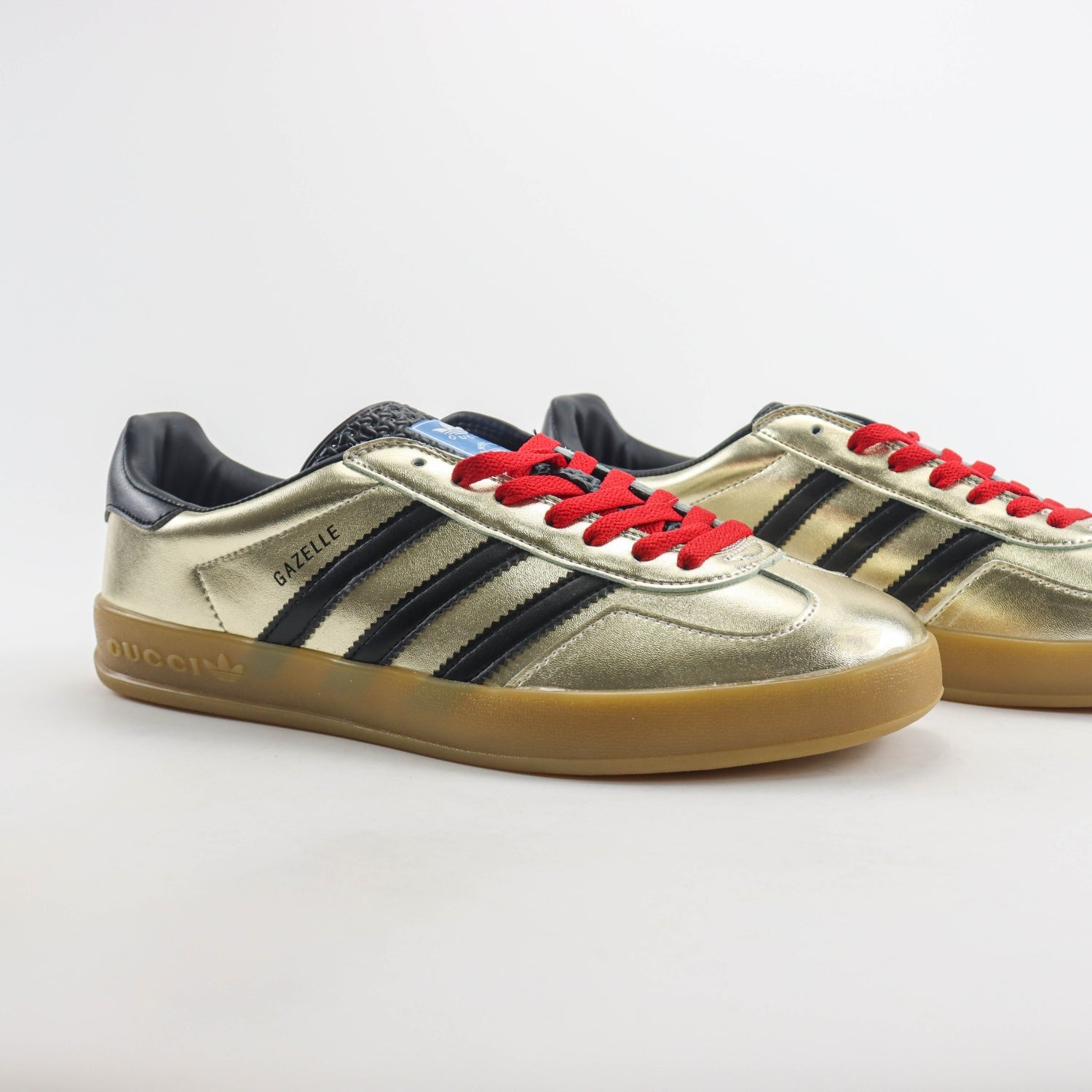 GG x Ads Gazelle Gold and Red Sneakers