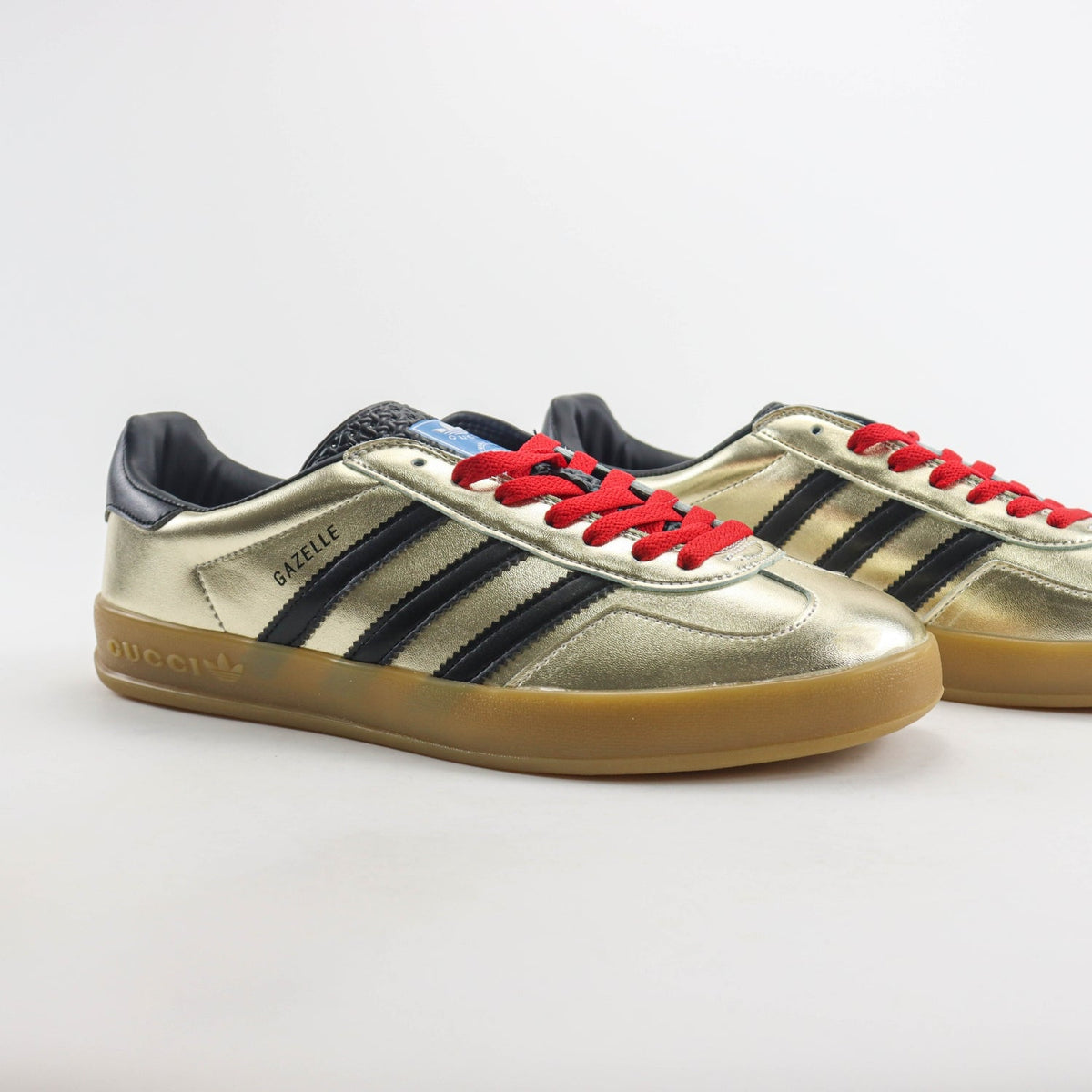 GG x Ads Gazelle Gold and Red Sneakers