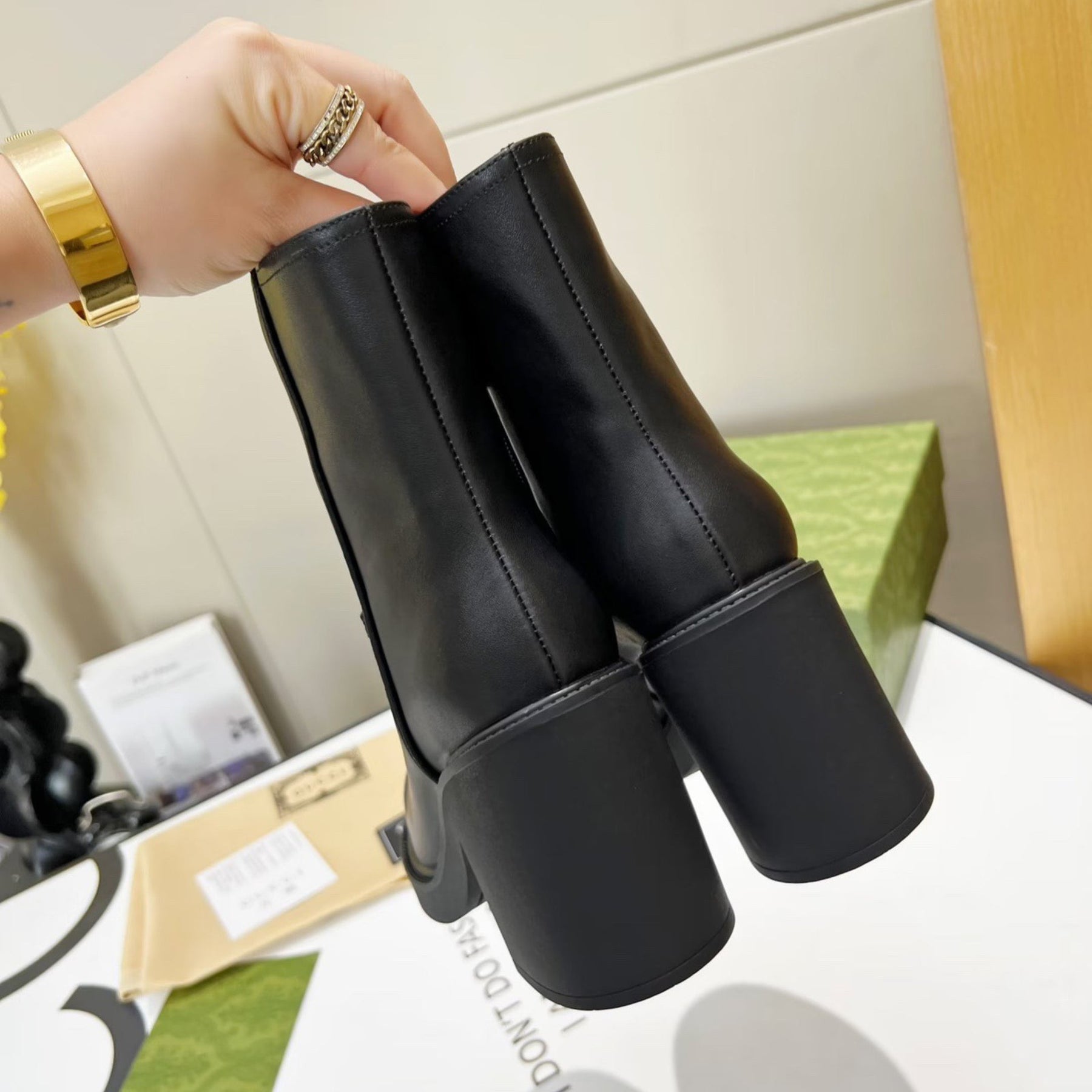 Black GG leather boot with logo