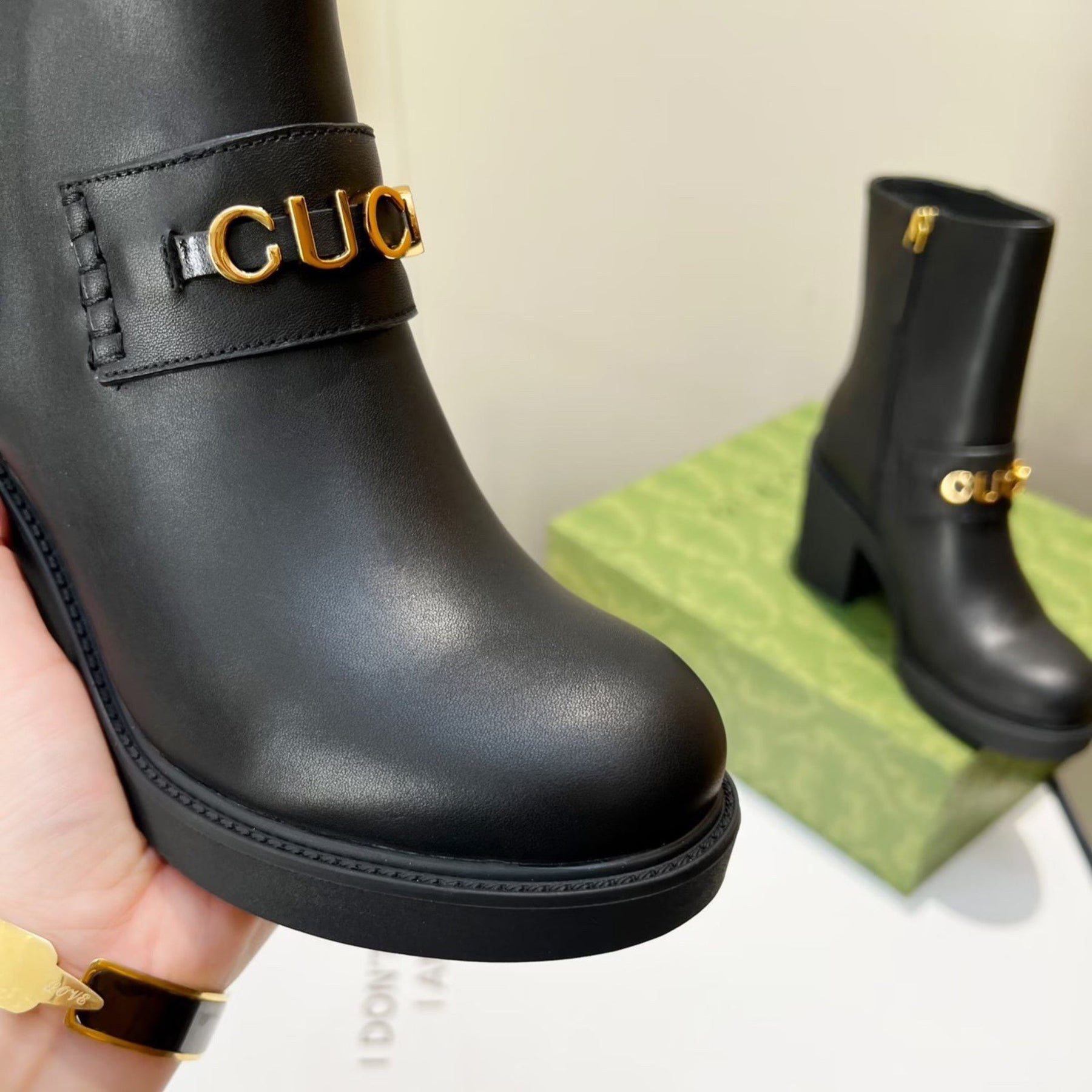 Black GG leather boot with logo